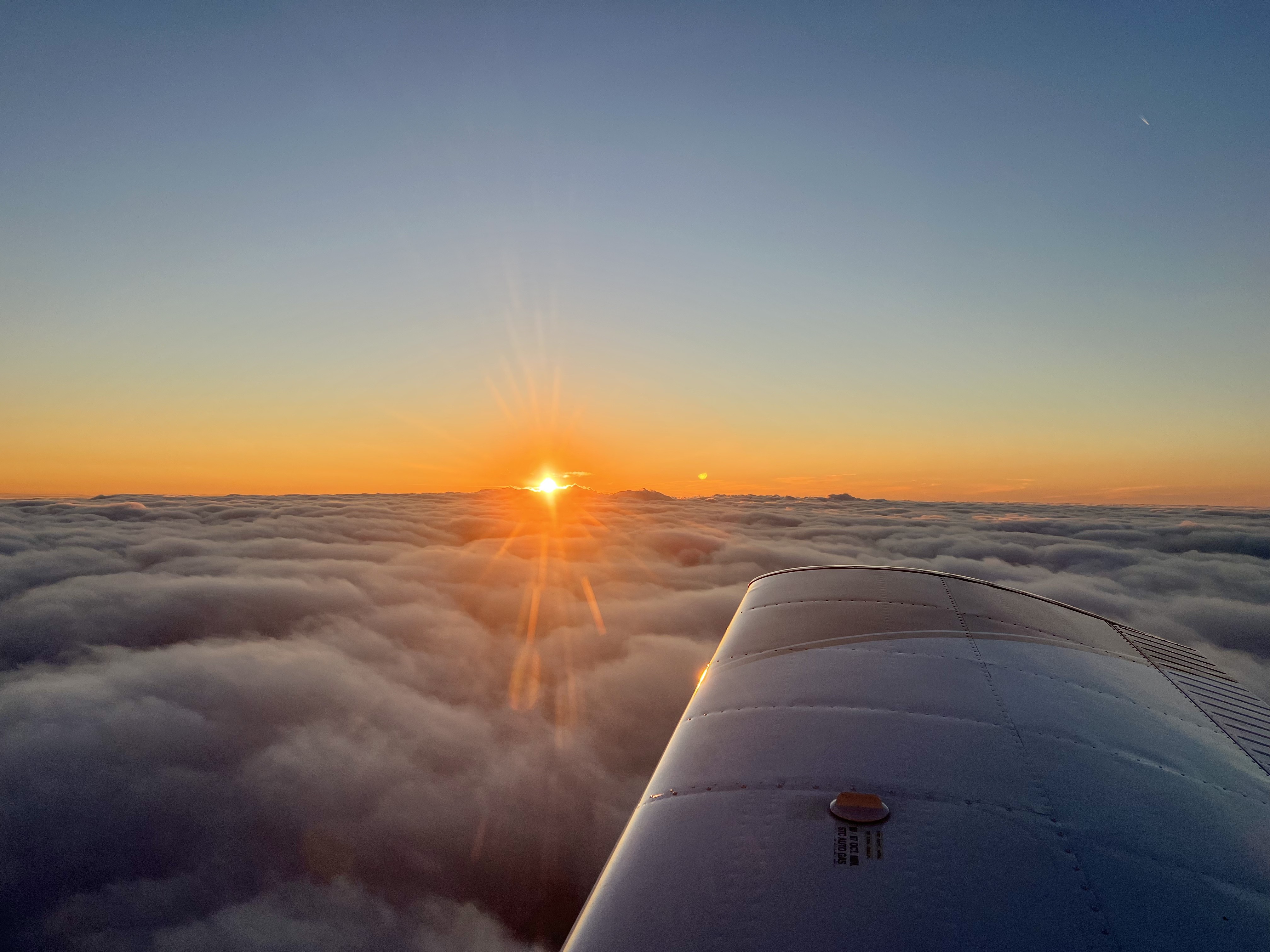 Mason Aviation aircraft on the runway at sunset